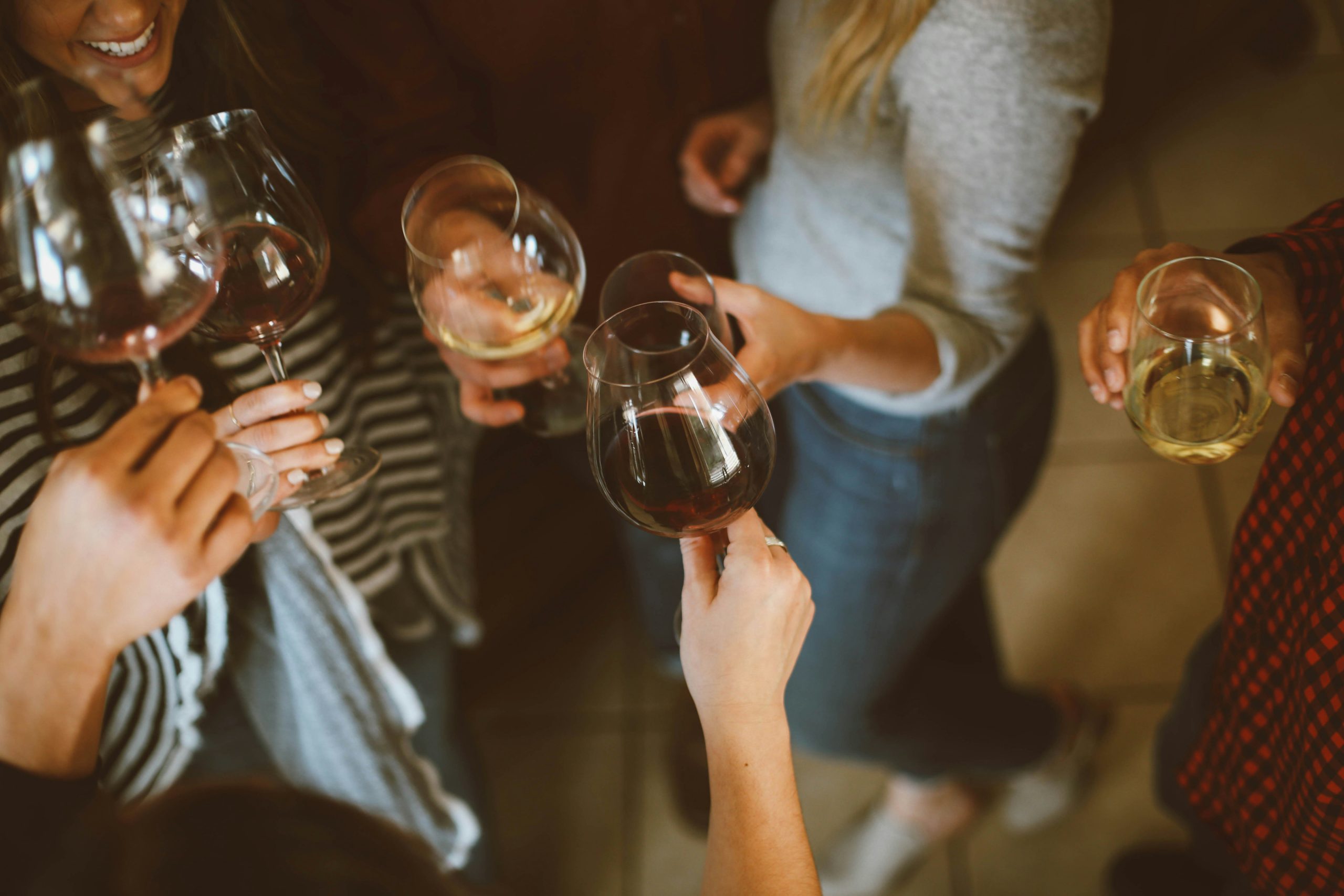 People sharing wine and conversation in an online wine community inspired by my Wination.